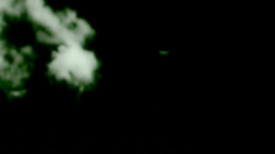 UFO, (Center Screen) Still Removed From Infrared Video Footage. UFO traveling and entered cloud formation. Antelope Valley, Ca. Photo by Jim Kerr.