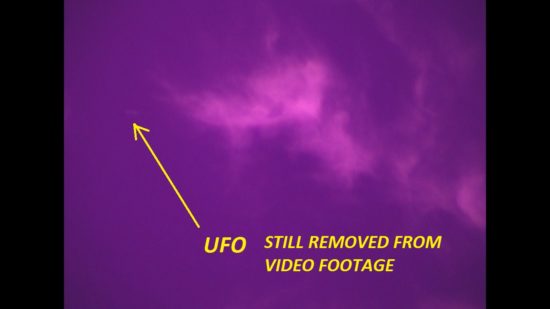 UFO Still from Full Spectrum Video Footage. Ufo traveling in and around clouds. Antelope Valley, Ca. Photo by Jim Kerr.