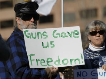 guns-gave-freedom-sign-ap